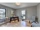 Bright home office features hardwood floors, built-in shelving, and large windows at 1900 Mornington Ln, Snellville, GA 30078