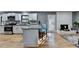 Modern kitchen with granite countertops and island at 1900 Mornington Ln, Snellville, GA 30078
