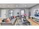 Living room features hardwood floors, gray walls, and comfy seating at 1900 Mornington Ln, Snellville, GA 30078