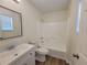 Bright bathroom with modern fixtures, white cabinets, and a shower-tub combo at 3648 E Melissa Ln, Douglasville, GA 30135