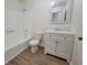 Clean, updated bathroom with a new vanity, tiled backsplash, and a shower-tub combination at 3648 E Melissa Ln, Douglasville, GA 30135