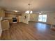 Open-concept living space featuring updated floors, a ceiling fan and a view of the kitchen at 3648 E Melissa Ln, Douglasville, GA 30135