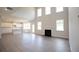 Open concept great room with kitchen and fireplace at 630 Edgemore Rd, Canton, GA 30114