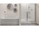 Modern bathroom with soaking tub and glass-enclosed shower at 349 Sound Cir, Stockbridge, GA 30281
