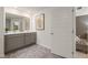 Bathroom featuring a large mirror, double sink vanity, and tile flooring at 349 Sound Cir, Stockbridge, GA 30281