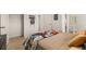 Bedroom featuring neutral-toned bedding and carpet, decorated with comic book themed decor and modern furniture at 349 Sound Cir, Stockbridge, GA 30281