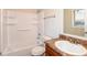 Clean bathroom, shower/tub combo, and wood vanity at 3762 Elkridge Dr, Decatur, GA 30032