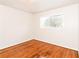 Well-lit bedroom, hardwood floors and window with blinds at 3762 Elkridge Dr, Decatur, GA 30032