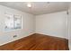 Bright bedroom with hardwood floors and large window at 3762 Elkridge Dr, Decatur, GA 30032
