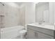 Bathroom boasts a shower/tub combo and gray vanity at 4745 Marjorie Dr, Cumming, GA 30041