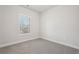Bright bedroom with gray carpet and a large window at 4745 Marjorie Dr, Cumming, GA 30041