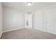 Bright bedroom featuring grey carpet, neutral walls and a door to the hallway at 4745 Marjorie Dr, Cumming, GA 30041