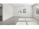 Bedroom with gray carpet and two large windows at 4745 Marjorie Dr, Cumming, GA 30041