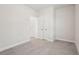 Spacious bedroom with gray carpet and double door closet at 4745 Marjorie Dr, Cumming, GA 30041