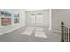 Bright bonus room featuring carpet, large windows, and ample natural light at 4745 Marjorie Dr, Cumming, GA 30041