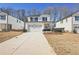 Two-story house with white siding, a gray stone base, and a two-car garage at 4745 Marjorie Dr, Cumming, GA 30041