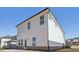 Two-story house with white siding, brick base, and patio at 4745 Marjorie Dr, Cumming, GA 30041