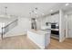 Modern kitchen with gray cabinets, quartz counters, and island at 4745 Marjorie Dr, Cumming, GA 30041