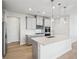 Modern kitchen with gray cabinets and stainless steel appliances at 4745 Marjorie Dr, Cumming, GA 30041