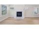 Light-filled living room features a marble fireplace and hardwood floors at 4745 Marjorie Dr, Cumming, GA 30041