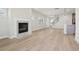 Open living room and kitchen area with hardwood floors at 4745 Marjorie Dr, Cumming, GA 30041