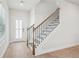 Elegant staircase with wrought iron railing and hardwood floors at 4745 Marjorie Dr, Cumming, GA 30041