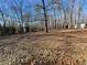 Spacious backyard with mature trees and two sheds at 1678 Se Christian Cir, Conyers, GA 30013