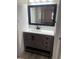 Bathroom vanity with gray wood cabinet and white countertop at 1678 Se Christian Cir, Conyers, GA 30013