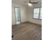 Bright bedroom with wood-look floors and ensuite bath at 1678 Se Christian Cir, Conyers, GA 30013