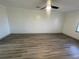 Bright bedroom with ceiling fan and wood-look flooring at 1678 Se Christian Cir, Conyers, GA 30013