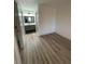 Well-lit bedroom with new flooring and access to bathroom at 1678 Se Christian Cir, Conyers, GA 30013