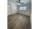 Spacious bedroom featuring wood-look floors and ceiling fan at 1678 Se Christian Cir, Conyers, GA 30013