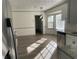 Bright dining area adjacent to kitchen with wood-look flooring at 1678 Se Christian Cir, Conyers, GA 30013