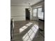 Bright dining area with hardwood floors and updated lighting at 1678 Se Christian Cir, Conyers, GA 30013