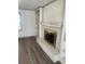 White brick fireplace with gold-toned surround in living room at 1678 Se Christian Cir, Conyers, GA 30013