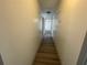 Long hallway with light walls and wood-look flooring at 1678 Se Christian Cir, Conyers, GA 30013