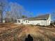 White brick ranch house with sunroom and large backyard at 1678 Se Christian Cir, Conyers, GA 30013