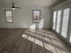 Spacious living room featuring hardwood floors and abundant natural light at 1678 Se Christian Cir, Conyers, GA 30013