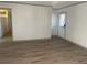 Spacious living room with wood-look vinyl flooring at 1678 Se Christian Cir, Conyers, GA 30013