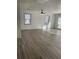 Sunlit living room with hardwood floors and fireplace at 1678 Se Christian Cir, Conyers, GA 30013