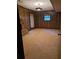 Finished basement room with brick fireplace and wood paneling at 4681 Mercer Rd, Stone Mountain, GA 30083