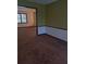 Dining room with brown carpet and view into living room at 4681 Mercer Rd, Stone Mountain, GA 30083