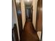 Long hallway with brown carpet and multiple doors at 4681 Mercer Rd, Stone Mountain, GA 30083