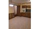 Kitchen with wood cabinets, white appliances, and tile floor at 4681 Mercer Rd, Stone Mountain, GA 30083