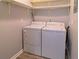 Convenient laundry room with washer, dryer, and overhead shelving at 1818 Ashborough Cir # E, Marietta, GA 30067