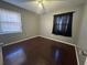 Bedroom with hardwood floors, light gray walls and a window at 4597 Karla Cir, Conley, GA 30288