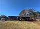 Charming brick home with a well-maintained lawn and a classic design under a clear blue sky at 4597 Karla Cir, Conley, GA 30288