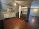 Efficient kitchen with stainless steel appliances and wood-look flooring, perfect for cooking at 4597 Karla Cir, Conley, GA 30288