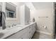 Bathroom with marble countertops, updated fixtures, and a glass shower at 6851 Roswell Rd # I18, Sandy Springs, GA 30328