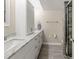Bathroom featuring double sinks, marble countertop, and a glass-enclosed shower at 6851 Roswell Rd # I18, Sandy Springs, GA 30328